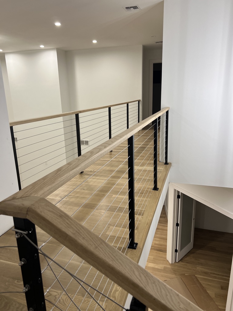 Upper interior bridge walkway with cable railing.