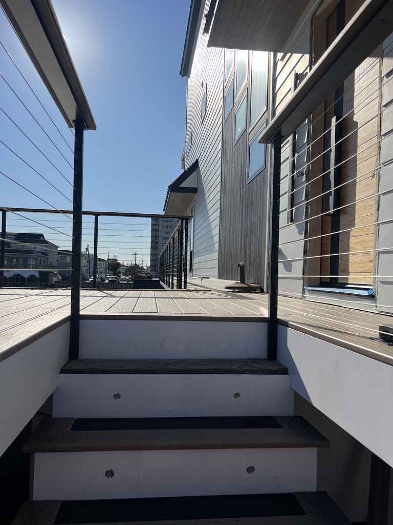 Approach to shore deck with cable railings.